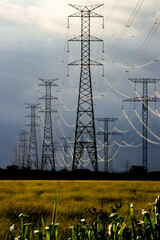 Campos dos Goytacazes, RJ, Brazil, 12/31/2024 - Electrical transmission towers and transmission lines in Campos' countryside, near Goytacazes district 
