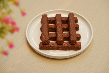 Chocolate wafers on a white plate, close-up