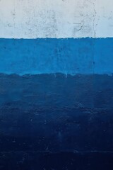 Obraz premium A textured wall featuring various shades of blue paint.