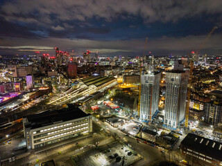 Fototapeta premium An aerial view of a bustling urban area featuring contemporary buildings and lively streets, showcasing the interaction between architecture and everyday city life.
