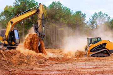 Bulldozer is leveling ground earthmoving on construction site in preparation for grading soil