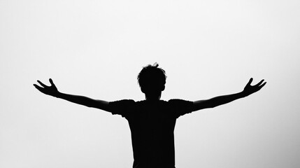 A silhouette of a person with arms outstretched against a light background.