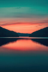 Obraz premium Serene lake at sunset, reflecting vibrant colors in the water.