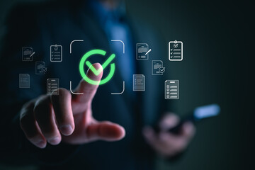 Businessman touching approved document icon on digital documents for approve business project proposals. Quality assurance and online evaluation of business concept.