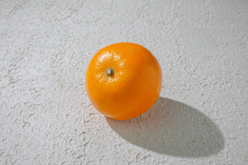 A vibrant orange isolated on a clean white background, representing freshness, health, and natural citrus goodness, ideal for food related visuals
