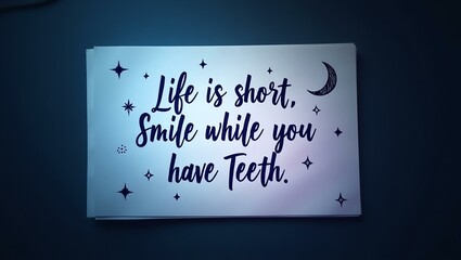 life is short smile while you still have teeth is written in neat, handwritten text on a textured notepad, arranged in a flat lay style against a dark, moody background