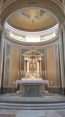 Fototapeta premium A beautifully adorned altar featuring candles and intricate architecture.