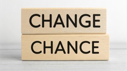 Two wooden blocks display the words "CHANGE" and "CHANCE," symbolizing the connection between transformation and opportunity.