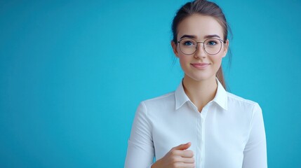 A young woman in glasses smiles against a blue background.