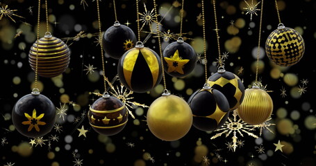 Swinging black and gold christmas baubles over snowflakes and bokeh lights on dark background