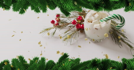 Fototapeta premium Image of stars falling over christmas drink and decorations