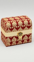 A decorative red and gold box with a clasp, suitable for storing jewelry or keepsakes.
