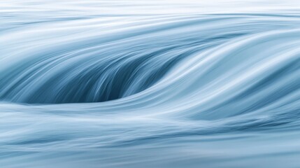 A serene, flowing water scene with soft blue tones and gentle movement.
