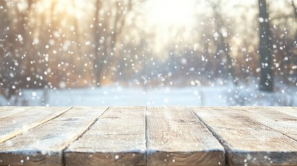 A wooden table sits covered in snow as delicate flakes fall, creating a peaceful winter atmosphere in a forested setting