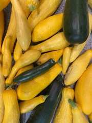 farm fresh organic yellow squash and zucchini (courgette) on granite countertop