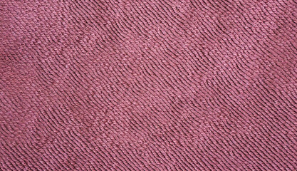Purple wavy surface of knitted fabric (machine knitted macro, texture).
