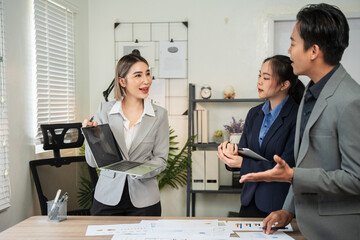 Asian business Talk about new projects, presents at home office.
