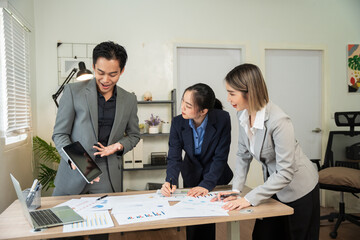 Asian business Talk about new projects, presents at home office.
