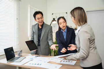 Asian business Talk about new projects, presents at home office.
