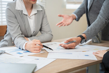 Asian businessman discusses new project presented at home office