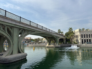 A vibrant snapshot of Riverland Dubai, where charming cobblestone streets, picturesque bridges, and scenic waterways transport you to a world of timeless charm. Lush greenery and European-style.