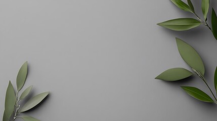Green leaves arranged on a gray background