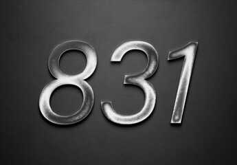 Chrome metal 3D number design of 831 on grey background.