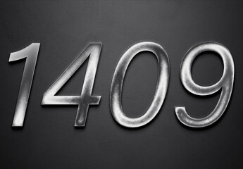 Chrome metal 3D number design of 1409 on grey background.