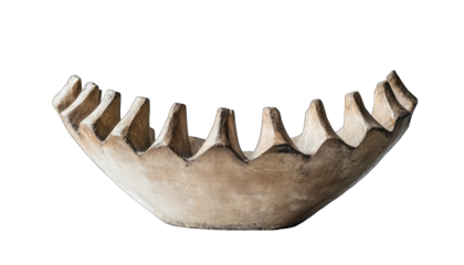 Abstract beige stone bowl with scalloped edges.