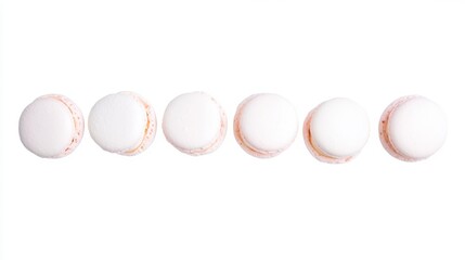 Obraz premium Delicious White Macarons in a Row French Pastry Sweet Treats Bakery Delights Isolated on White