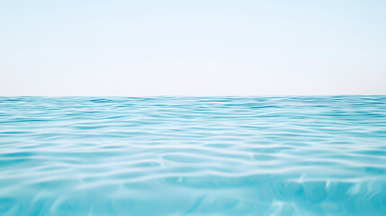 Obraz premium Calm blue ocean water with gentle ripples under clear sky, creating serene and tranquil atmosphere. Perfect for relaxation and peaceful moments
