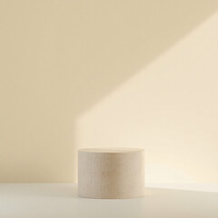 cylindrical beige platform on a white surface