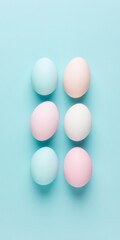 Pastel Easter Eggs on Soft Blue Background - Minimalist Spring Decor