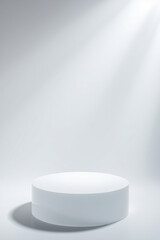 white cylindrical pedestal under soft light