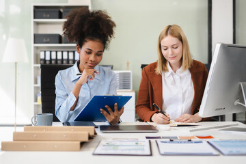 Diverse professionals collaborate on project analysis with financial graphs. Strategic teamwork and insights drive company growth and success.