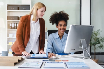 Diverse professionals collaborate on project analysis with financial graphs. Strategic teamwork and...