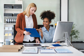 Diverse professionals collaborate on project analysis with financial graphs. Strategic teamwork and insights drive company growth and success.