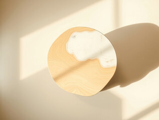 round wooden table with a light beige top inlay