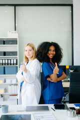 Fototapeta premium Doctors and nurses using laptops and clipboards, showcasing teamwork, modern healthcare.
