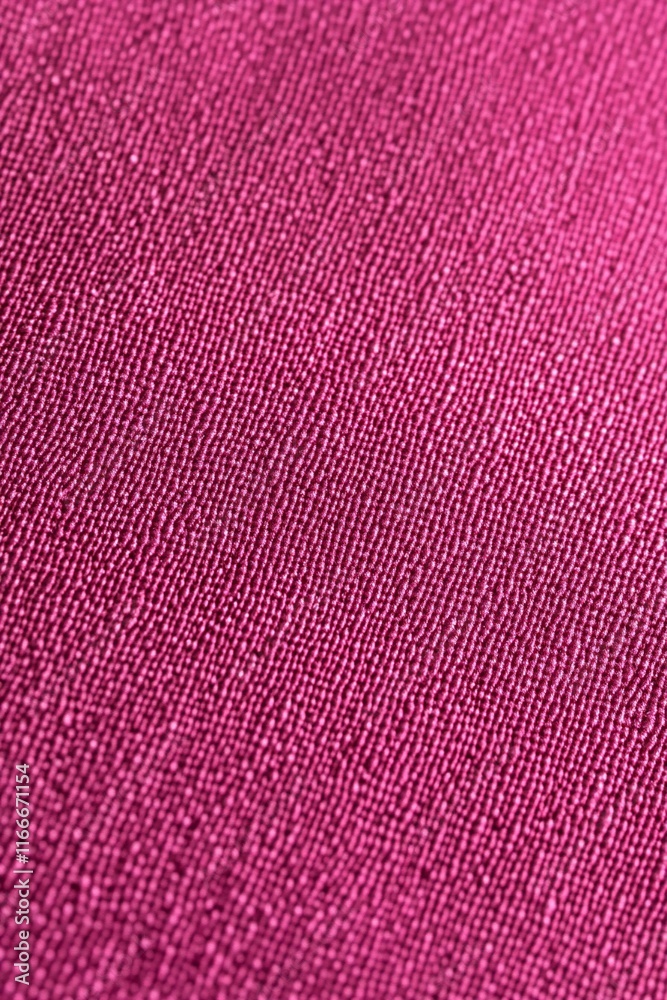 Poster close-up of pink fabric texture with subtle herringbone weave.