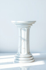 white marble pedestal with a circular top