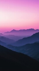 Fototapeta premium A serene mountain landscape at dusk with soft purple hues.
