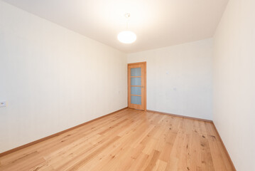 Minimalist Empty Room With Wooden Floor and Closed Wooden Door. Home Interior