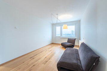 Minimalist Modern Home Living Room Interior with Large Windows and Cozy Seating. Home Interior