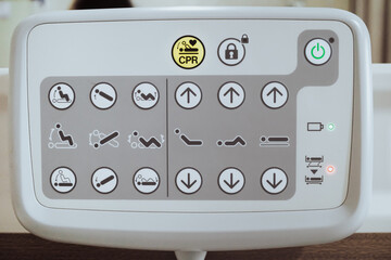 Closeup view of adjustable hospital patient bed position control instruction panel board