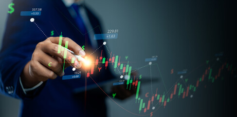 Businessman analyzing stock market chart and candle graph for financial growth and economic success. Touching financial graph interface strategic investment in stock market for future growth.