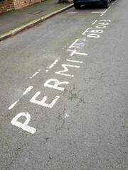 Fototapeta premium A car parking bay in the street only for the use of a particular disabled permit holder.