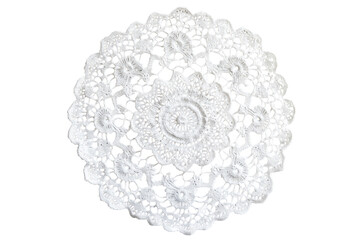 Delicate white crochet doily showcasing intricate floral patterns and textures
