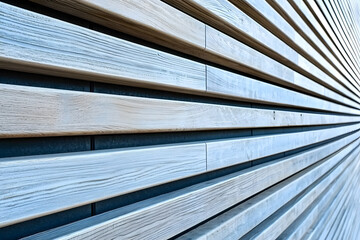 Obraz premium Smooth wooden wall with horizontal grooves, showcasing modern design and natural textures. interplay of light and shadow enhances aesthetic appeal of wood