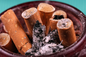 Full Ashtray with Cigarette Butts and Ashes